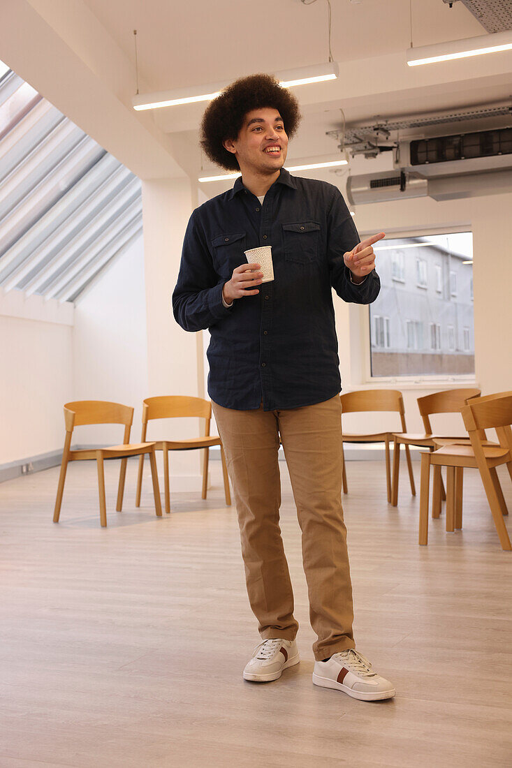 Smiling man standing in office