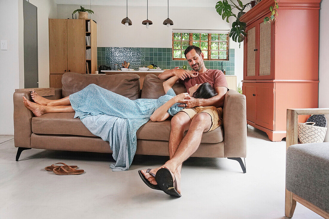 Couple relaxing on sofa