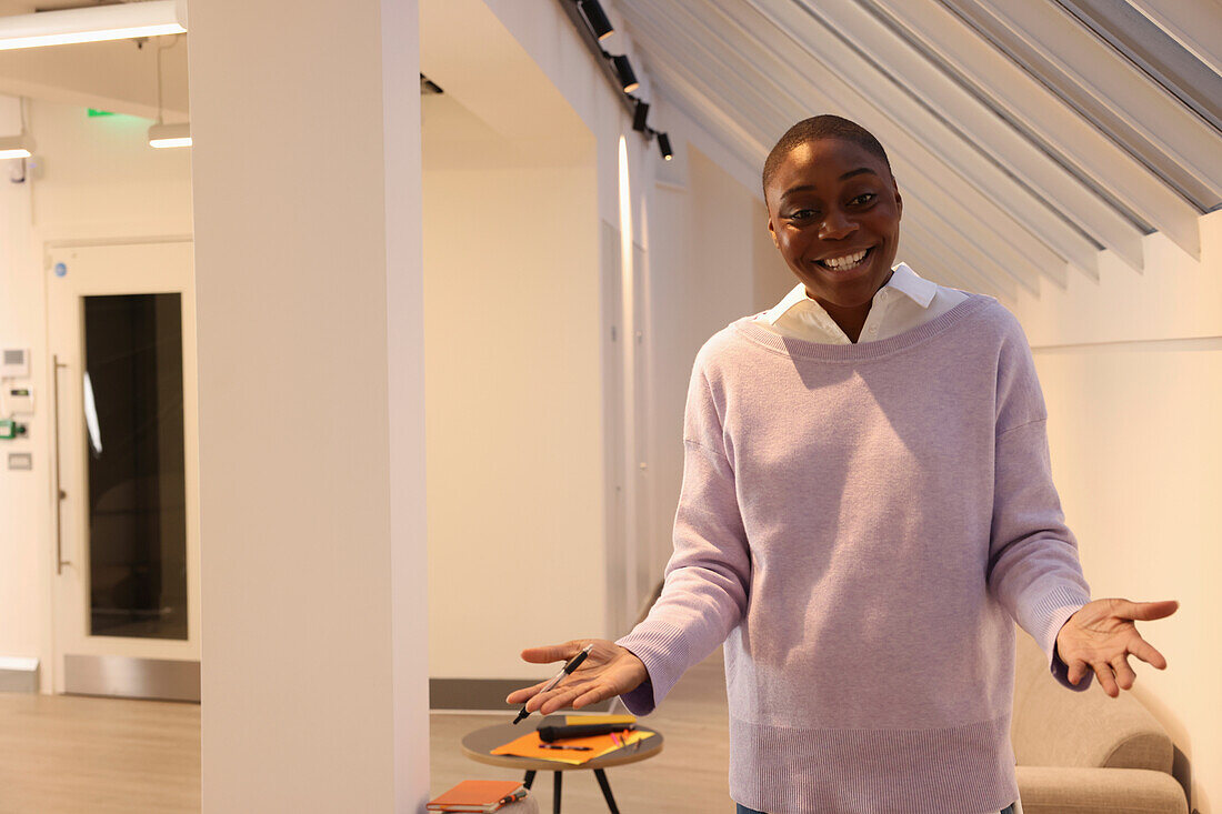 Smiling businesswoman dressed in casual clothes in office