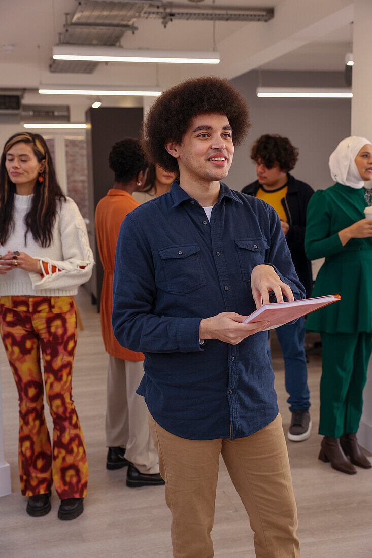 Employee smiling during team meeting