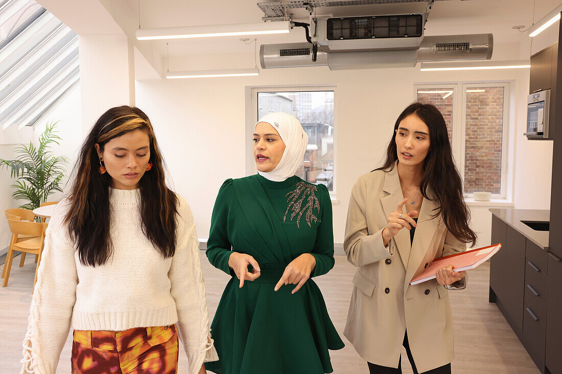 Women walking in office