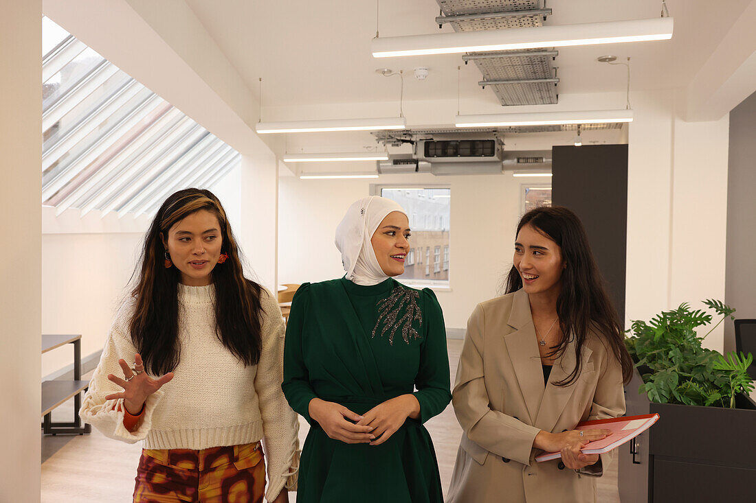 Women walking in office