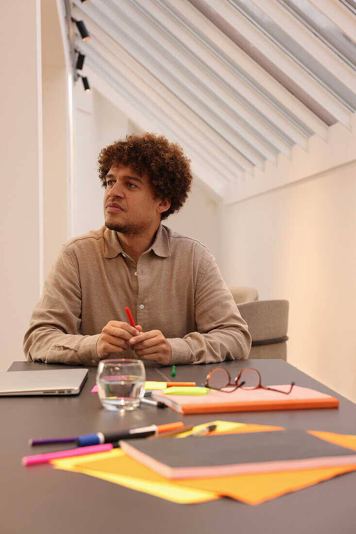 Man sitting at table in office