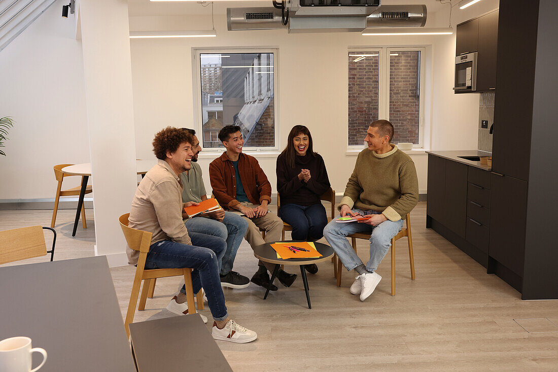 Coworkers having meeting in office