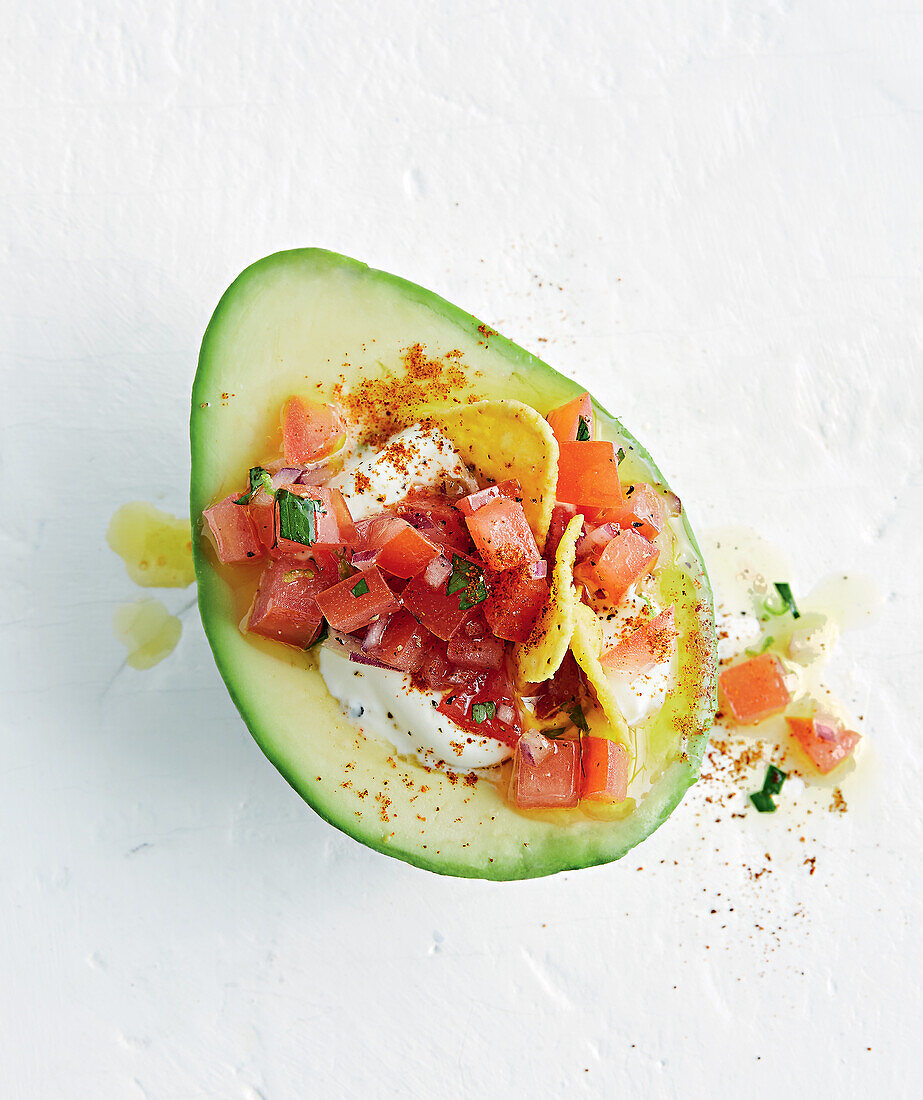 Stuffed avocado with tomato salsa and crème fraiche