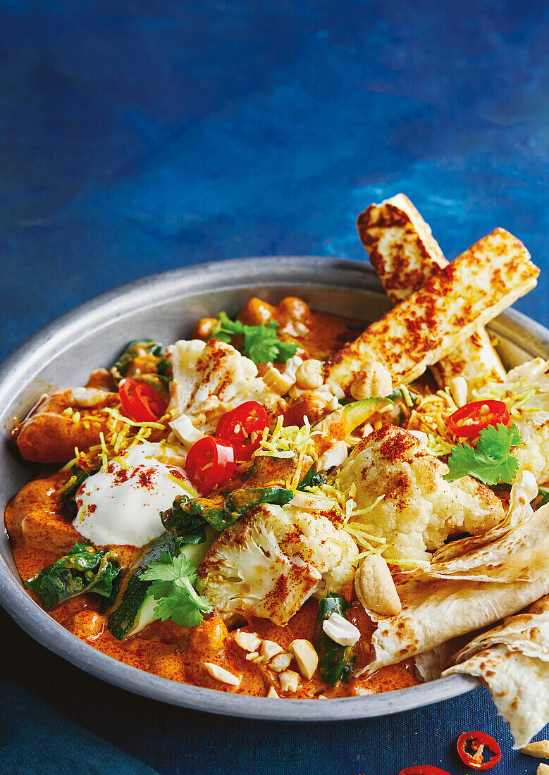 Butter cauliflower with paneer and naan bread