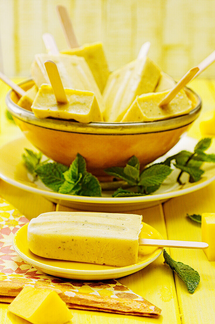 Mango and mint ice cream on a stick