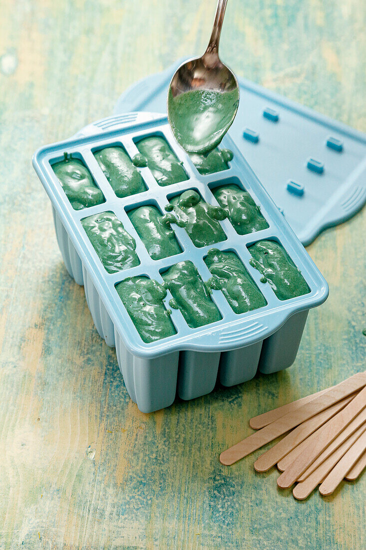 Spirulina ice cream in plastic mould