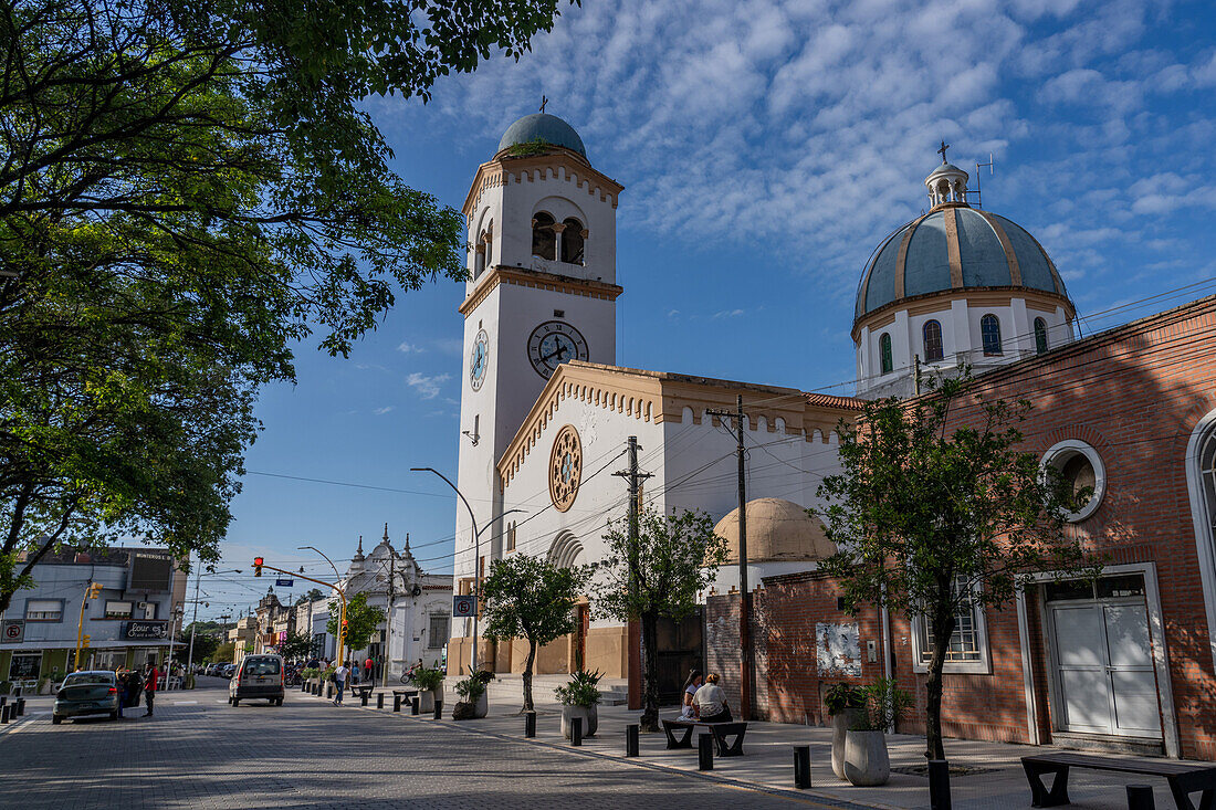 The exterior of the Church of Our Lady of the Rosary with its single bell tower with a clock. Monteros, Argentina.