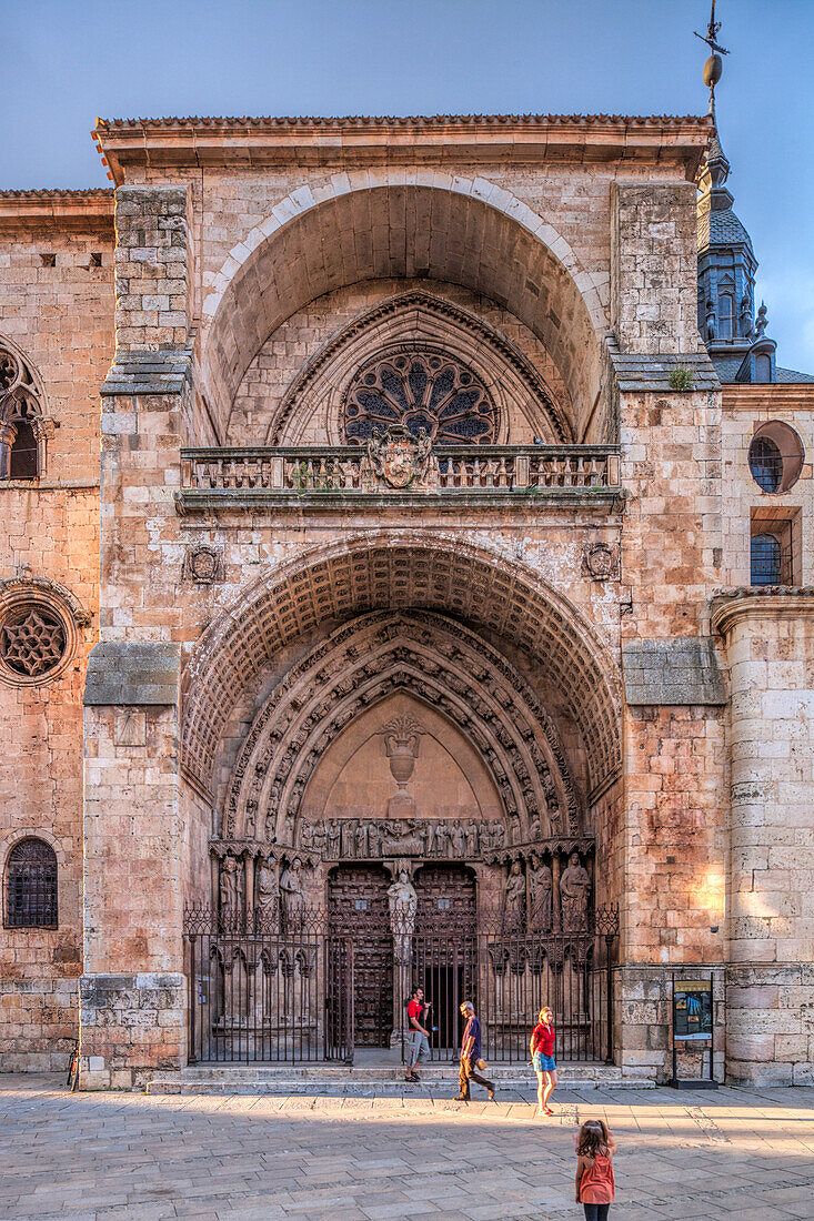 Burgo de Osma, Spain, Aug 12 2009, Visitors admire the intricate details of the Cathedral\'s facade in El Burgo de Osma, Soria, showcasing rich architectural features and history.