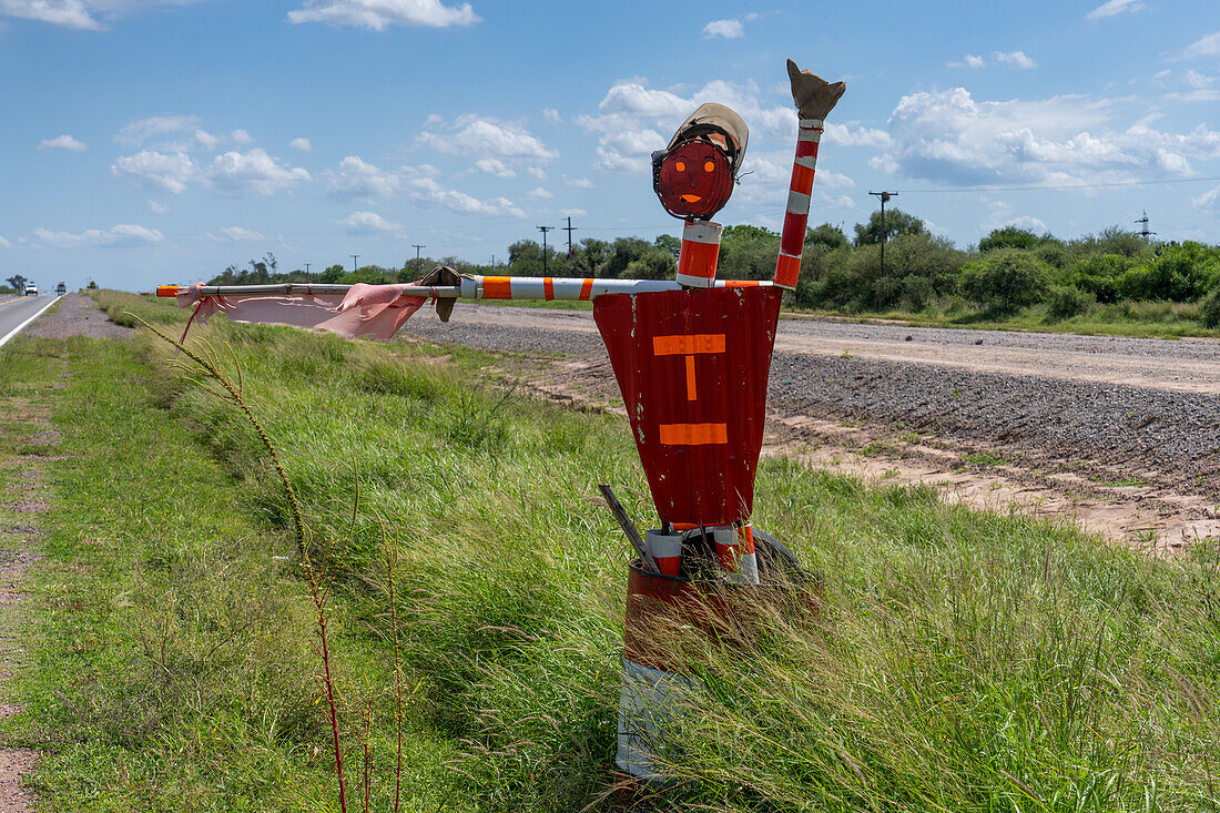 A metal flagman mannequin to warn of road construction near Termas de Rio Hondo, Santiago del Estero Province Argentina.