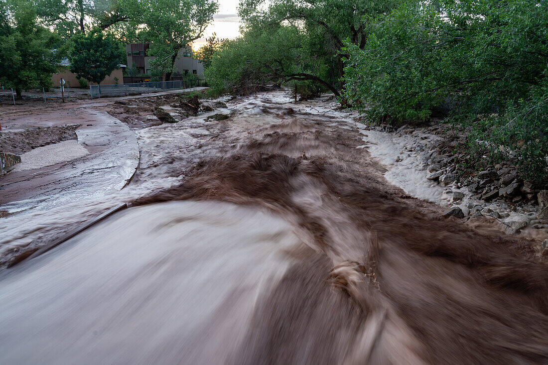 Slow shutter speed smoothing out the turbulent waters of flash flooding after a summer rain storm in Moab, Utah.