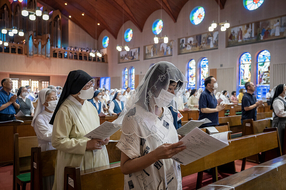 Night mass on August 9th, every year, in memory of the victims of the atomic bomb. Urakami Cathedral, Nagasaki, Japan