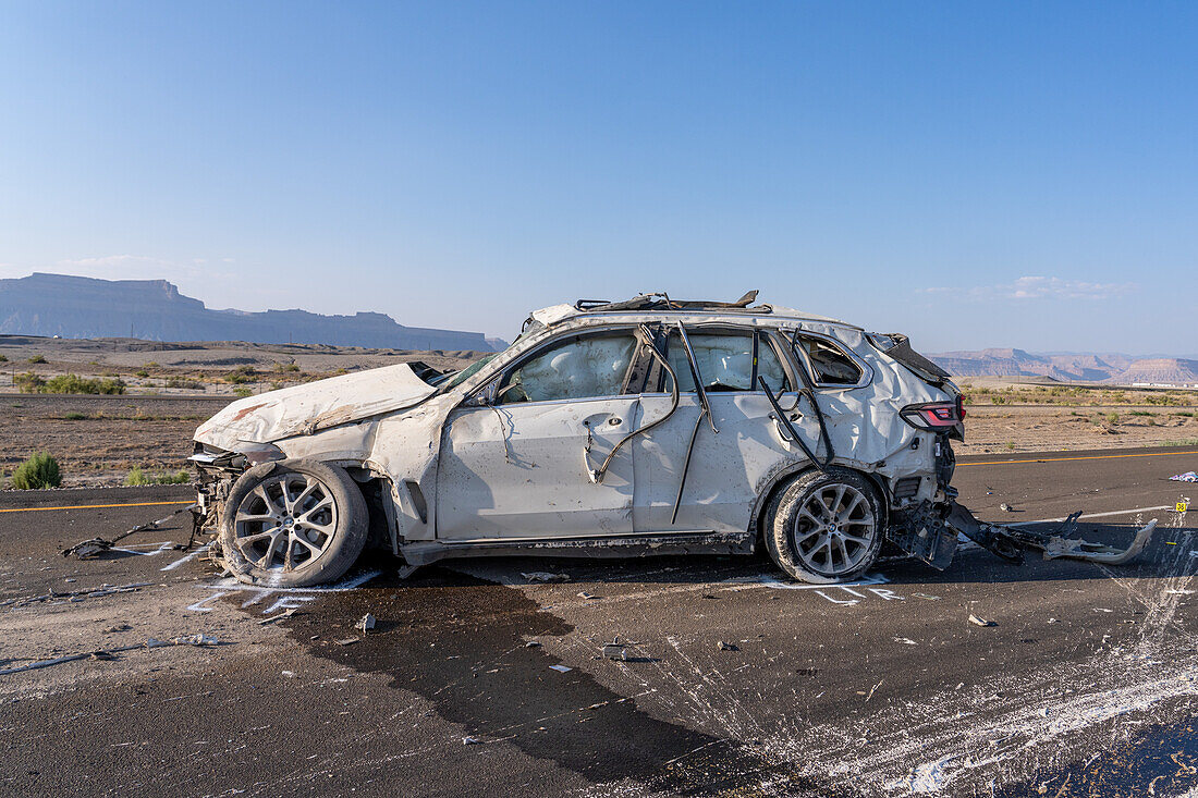 Law enforcement officers investigate a deadly auto crash in Utah.