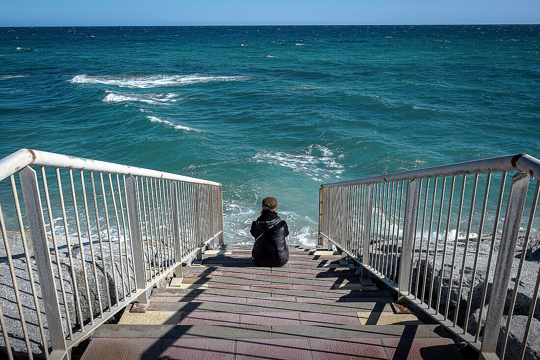 Stairs leading to a beach that has disappeared, in Vilassar de Mar, El Maresme, Catalonia, Spain