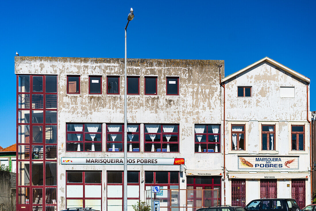 Porto, Portugal, Apr 15 2017, Facade of the closed Marisqueira dos Pobres restaurant in Matosinhos, Porto, Portugal, showing weathered exterior and urban setting.