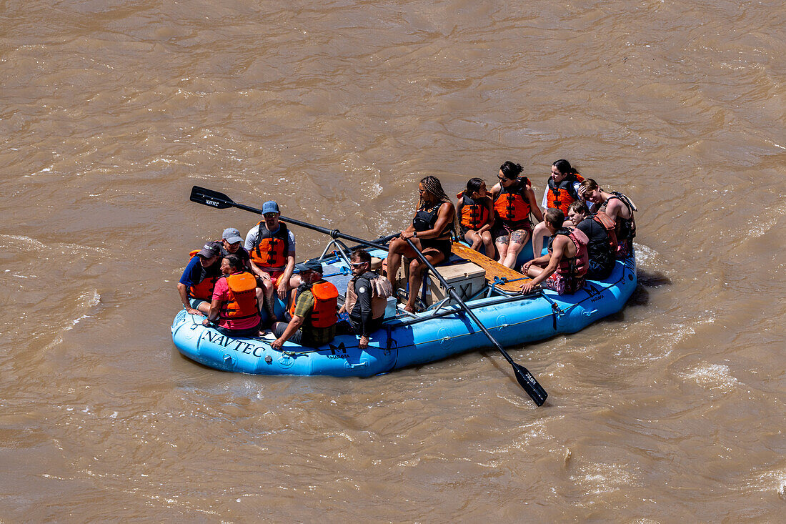 Tourists enjoy a rafting trip on the Colorado River near Moab, Utah.