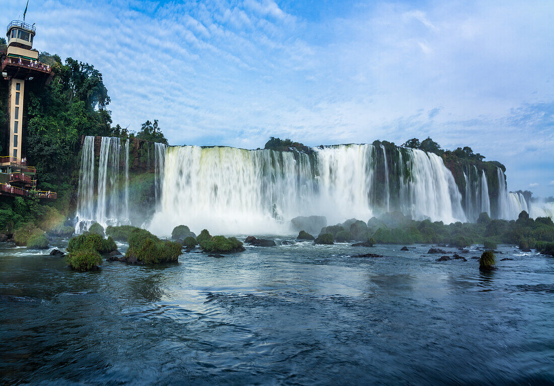 A rainbow in front of the Floriano Waterfall at Iguazu Falls National Park in Brazil. A UNESCO World Heritage Site.