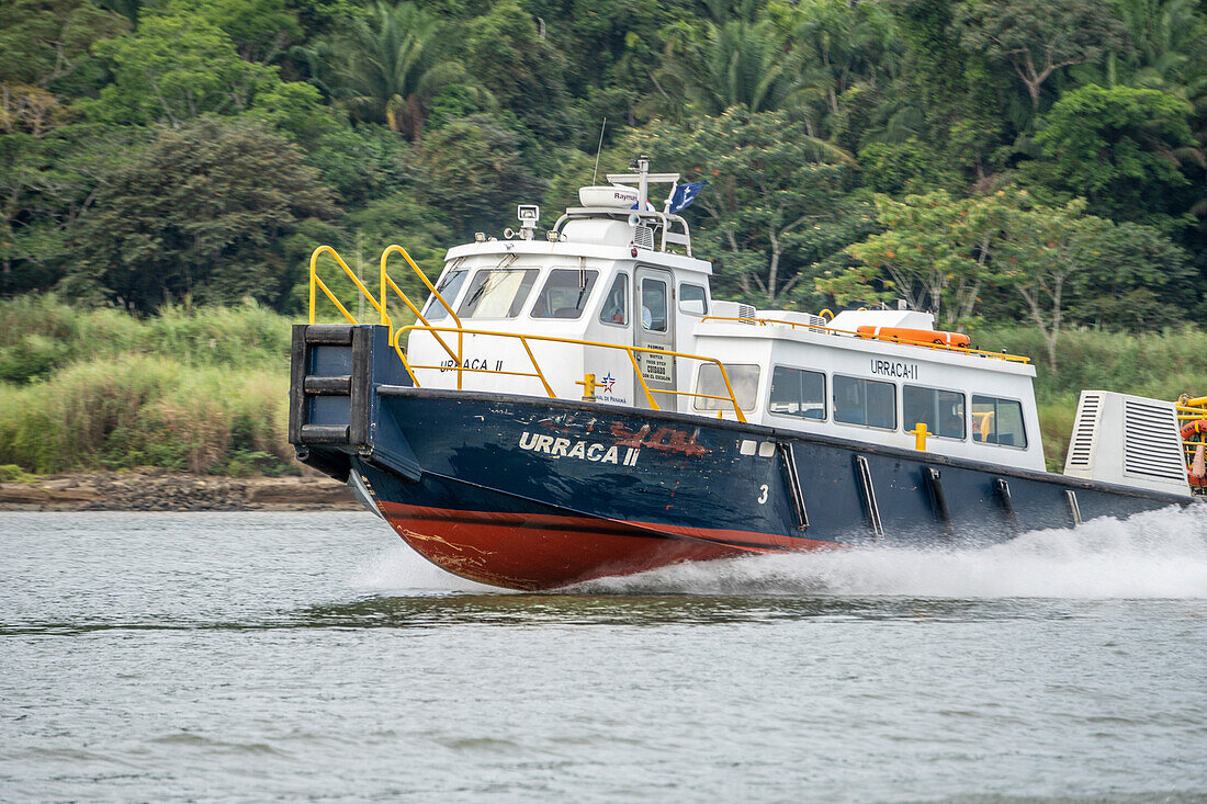 Boat gliding across Panama Canal