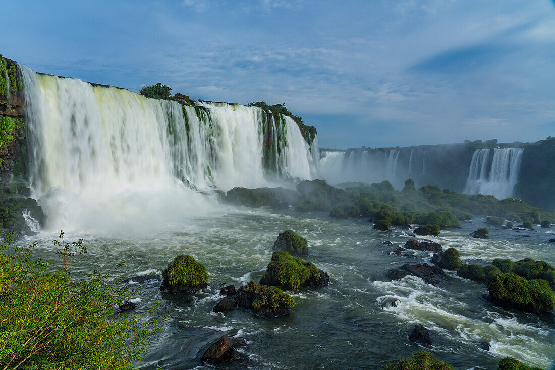 Iguazu Falls National Park in Argentina at right with Brazil at left. A UNESCO World Heritage Site. Pictured is the Floriano Waterfall at left with the Devil's Throat or Garganta del Diablo, center, and Two Musketeers Falls at right.