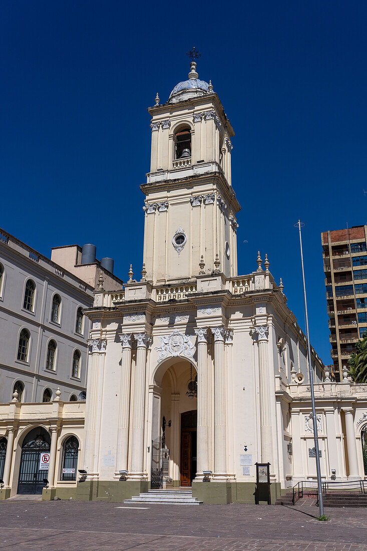 The exterior of the Cathedral of San Salvador de Jujuy, Argentina. The moon is to the right of the bell tower.