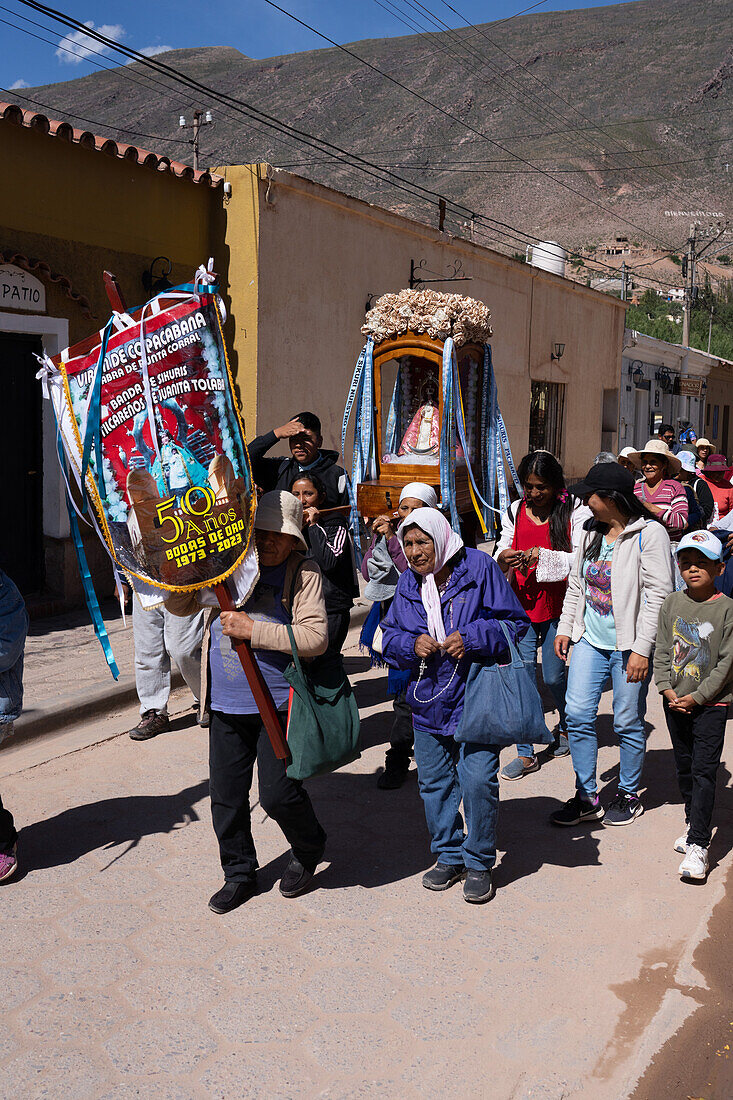 Parishioners carry a statue of the Virgin in a religious procession in the town of Tilcara, Argentina.