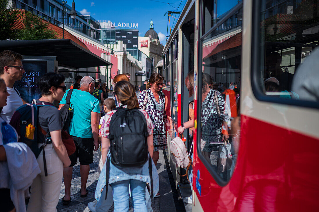 People waiting for the tram in Prague