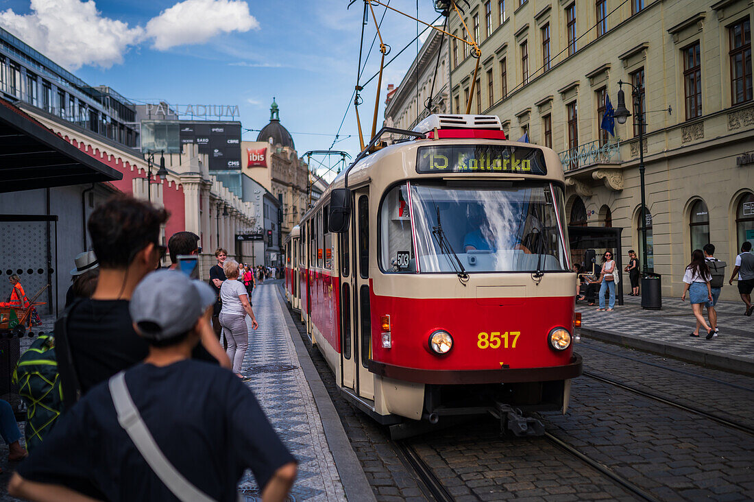 People waiting for the tram in Prague