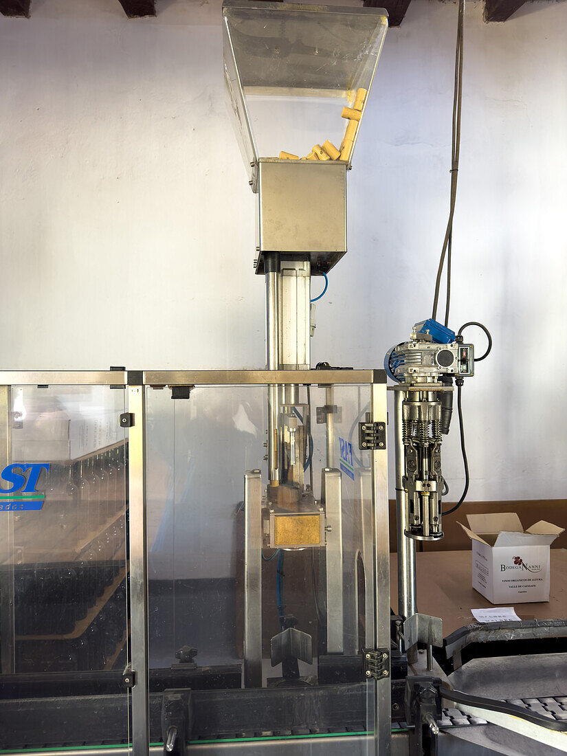 Automated wine-bottle corking machinery in the Bodega Nanni Winery, Cafayete, Argentina.