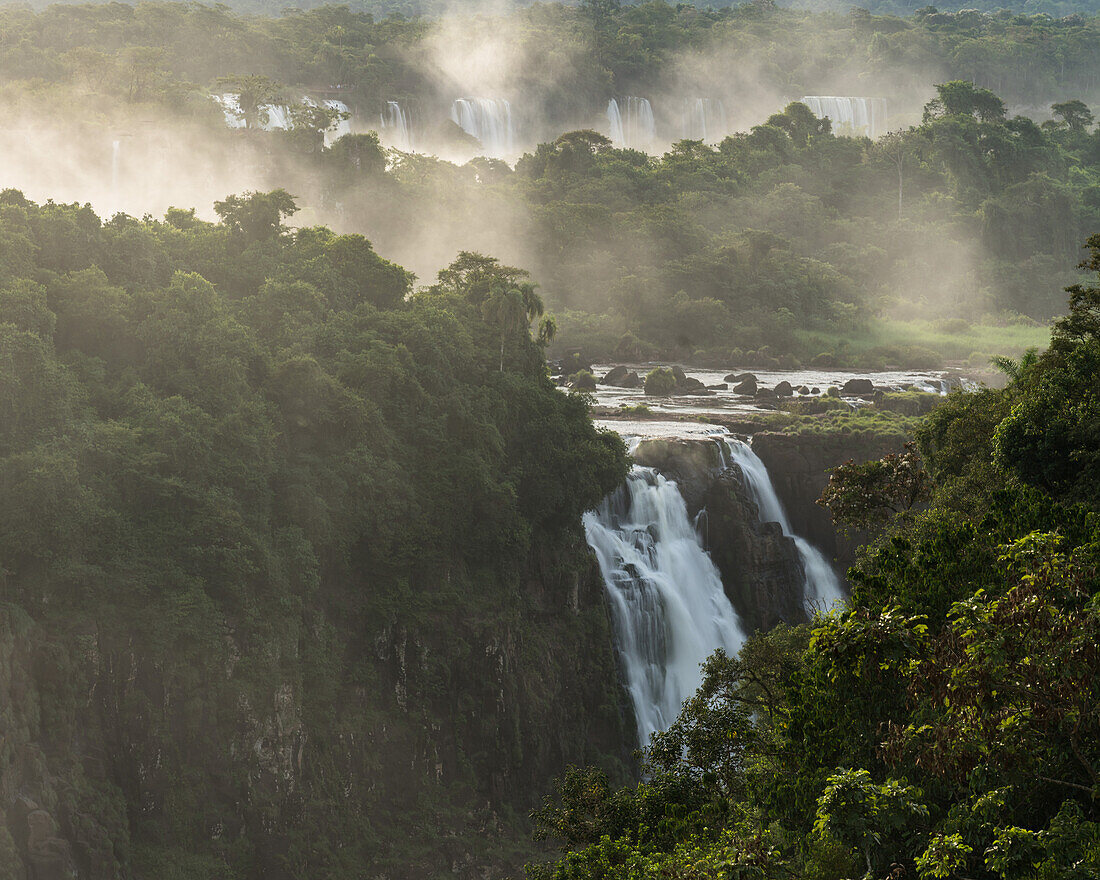 Iguazu Falls National Park in Argentina, as viewed from Brazil. A UNESCO World Heritage Site. Looking downriver toward the Three Musketeers Waterfall.