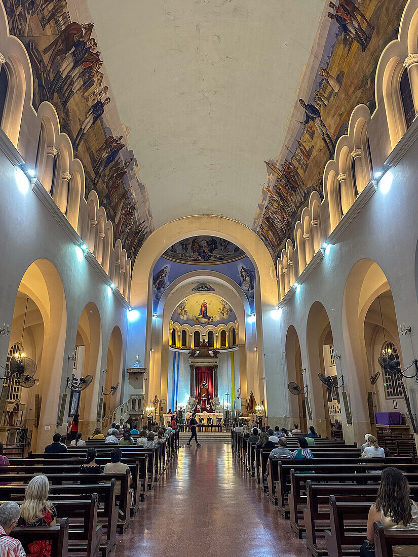 Worshippers in the nave of the Basilica de Nuestra Señora de la Merced, San MIguel de Tucumán, Argentina.