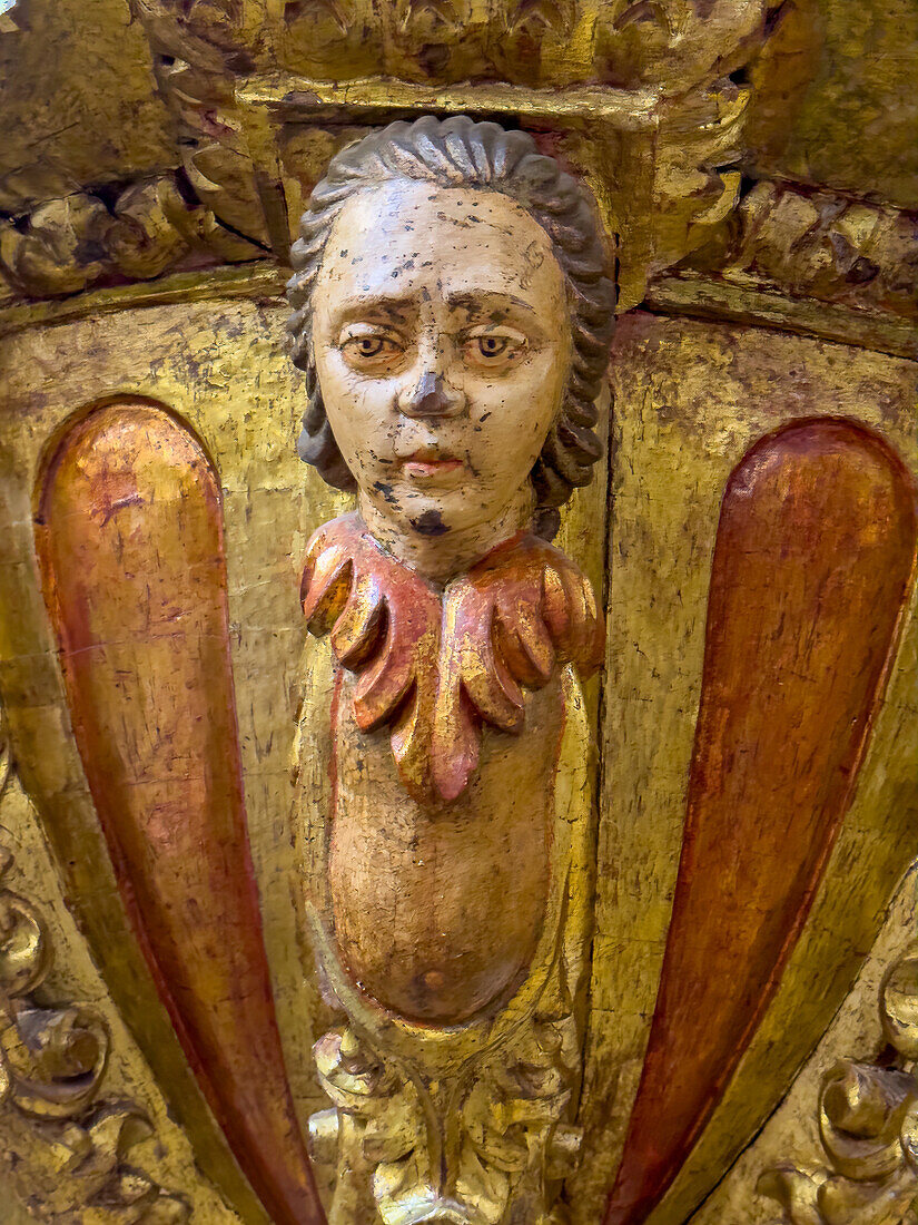 Detail of the ornately-carved wooden pulpit in the Basilica of San Francisco in San Salvador de Jujuy, Argentina.