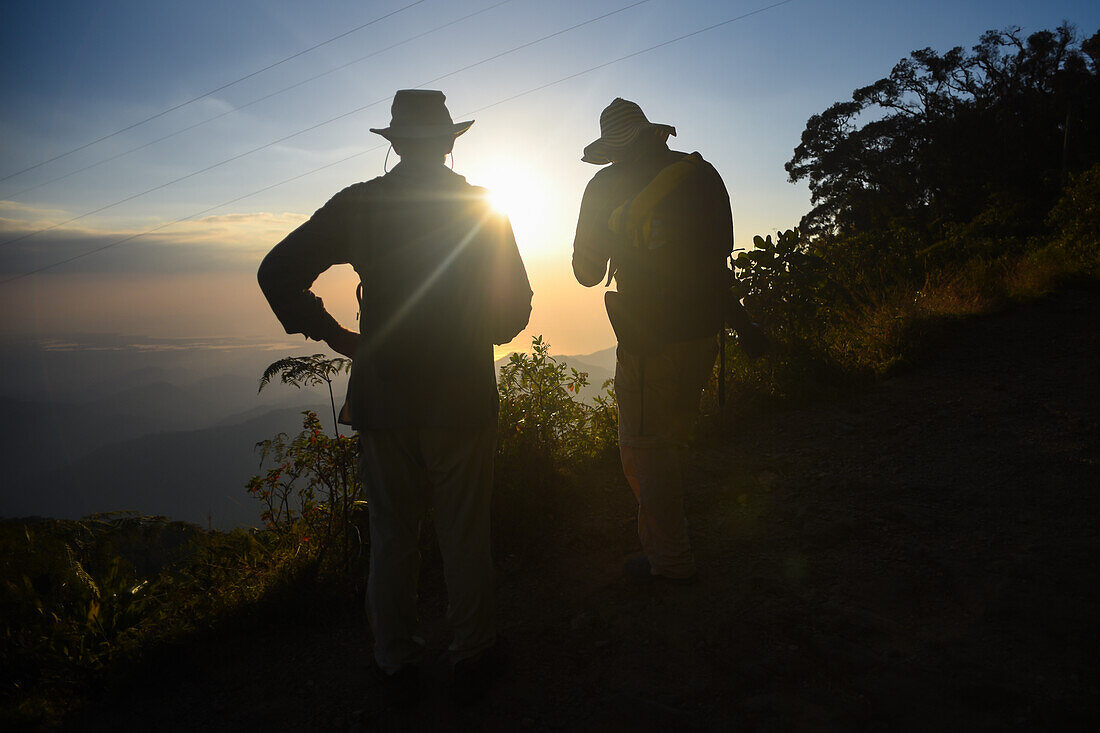 Hikers enjoying a beautiful sunset in Sierra Nevada de Santa Marta, Colombia