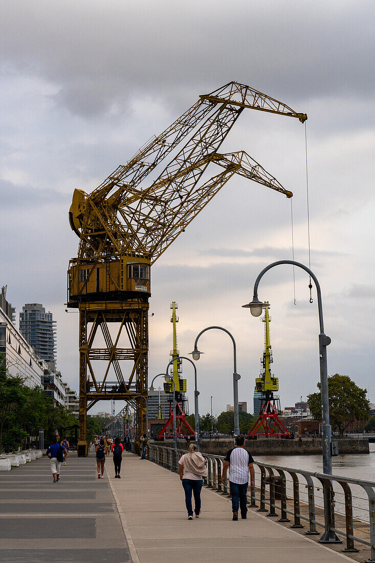 Retired gantry cranes for loading ships on display in the former docks of Puerto Madero, Buenos Aires, Argentina.