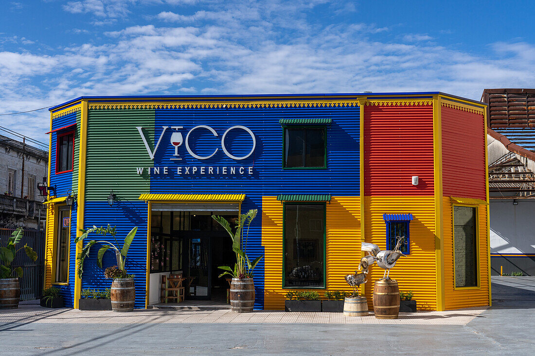 A colorfully-painted wine shop in La Boca, painted like the buildings on Caminito. Buenos Aires, Argentina.