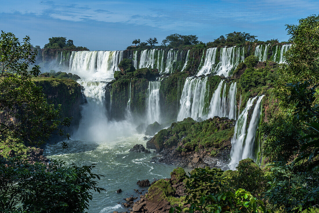 The powerful San Martin Waterfall at left with Mbigua Falls at right in Iguazu Falls National Park in Argentina. A UNESCO World Heritage Site.