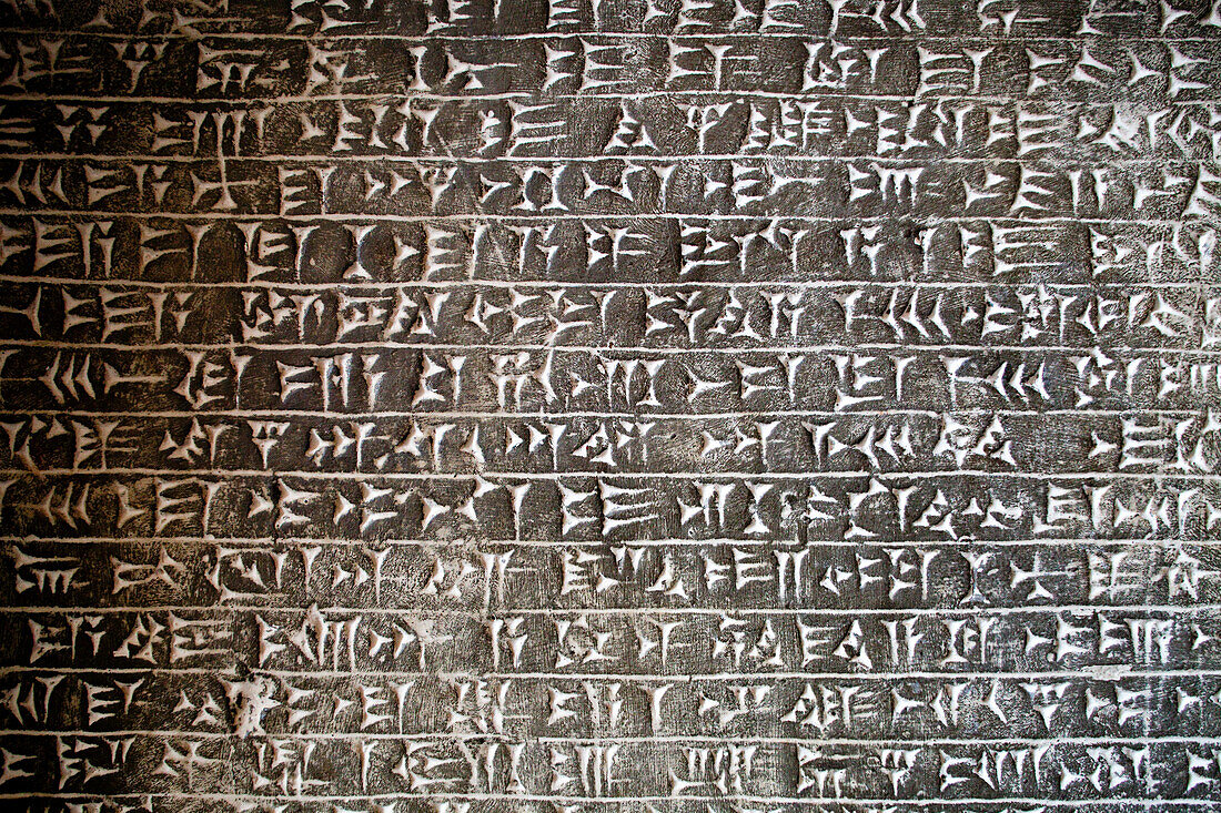 Berlin, Germany, July 24 2009, Discover intricate Assyrian cuneiform writing carved on stone at the Pergamon Museum in Berlin, showcasing ancient civilization.