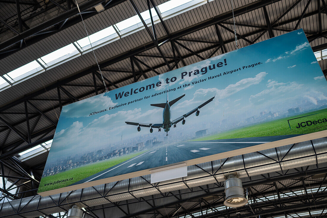 Welcome to Prague sign for advertising by JCDecaux in Prague Airport