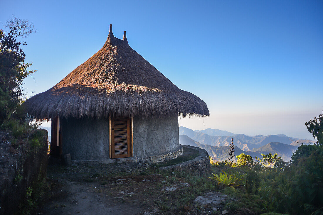 Kogihabs (individual huts, inspired by the architecture of the kogui indigenous tribe) at El Dorado Nature Reserve Lodge with views of the Sierra Nevada de Santa Marta and its legendary sunsets over the Caribbean Sea, Colombia