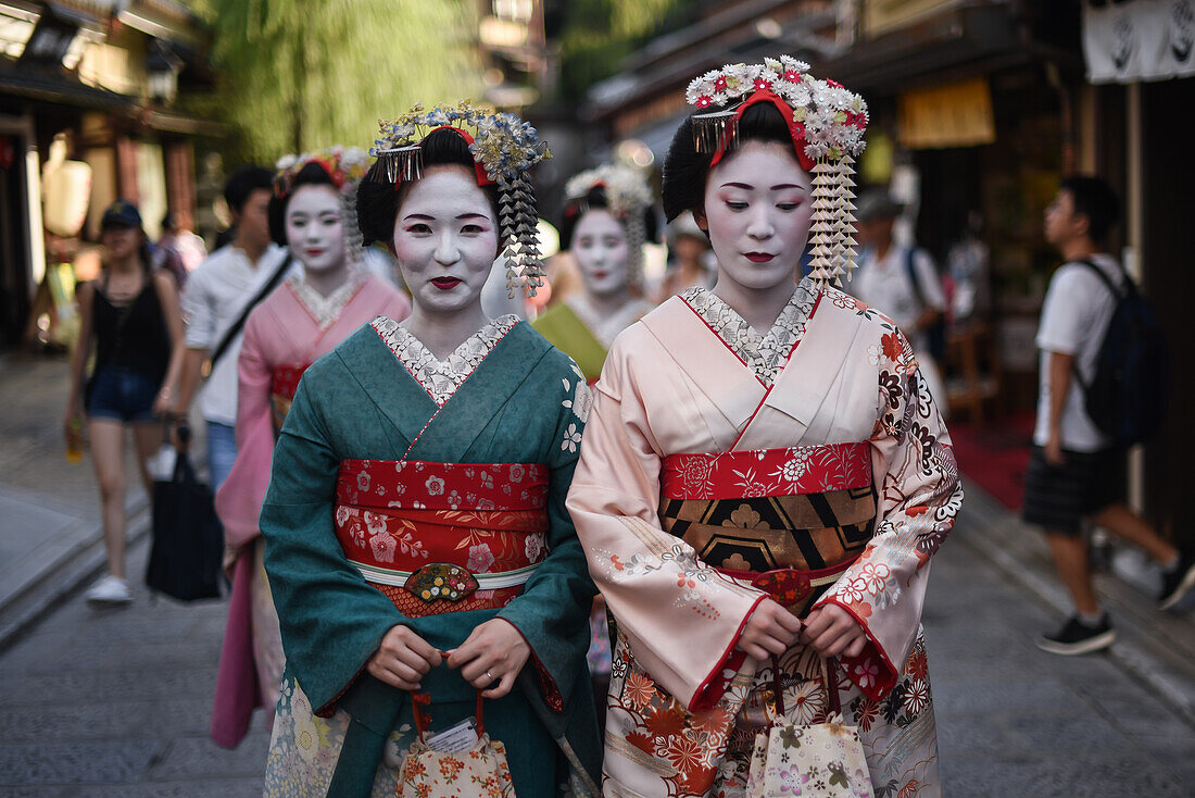 Group of women dressed as Maikos in the streets of Kyoto, Japan