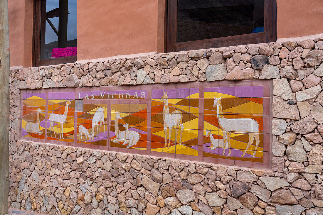 A ceramic tile sign for Las Vicuñas tourist lodging in Purmamarca, Argentina.