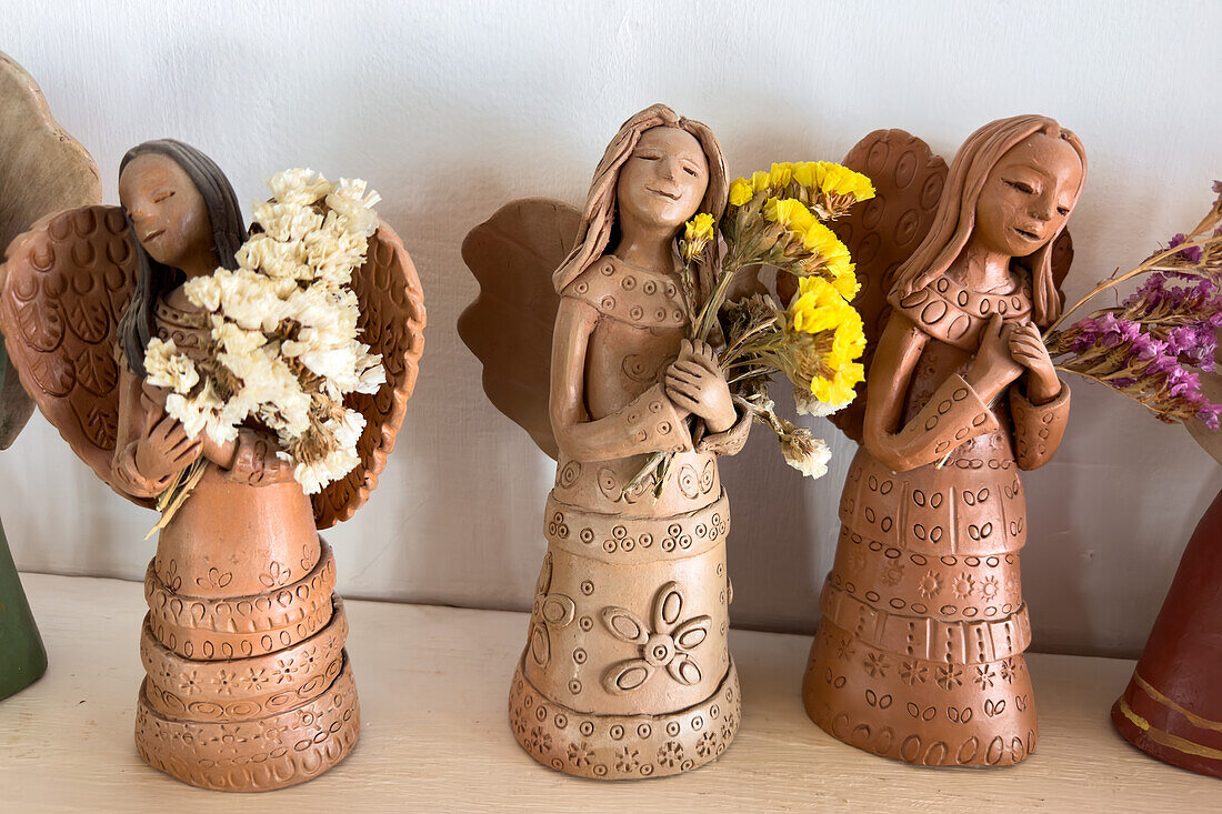 Ceramic angels by indigenous Aymara ceramic artist Santina Alabar in Purmamarca, Argentina.