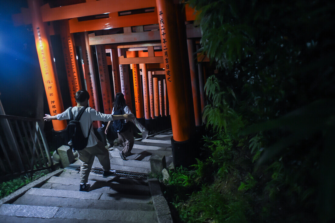 Exploring Fushimi Inari Taisha temple at night, Kyoto, Japan