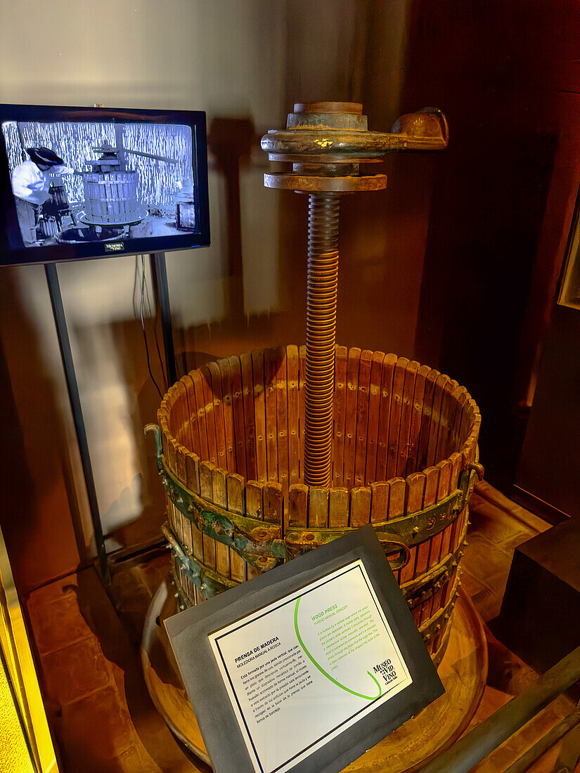 A vintage wooden grape press in the Museo de la Vid y el Vino or Museum of the Vine and the Wine in Cafayate, Argentina.