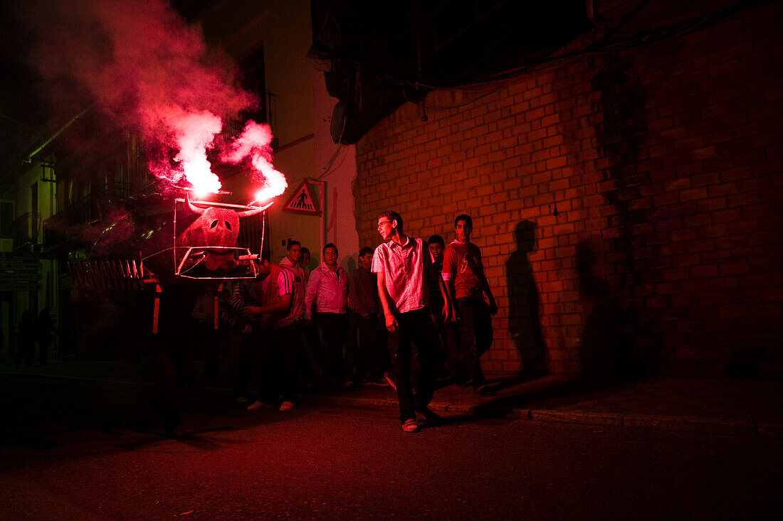 Aznalcazar, Spain, Oct 26 2008, The Toro de Fuego lights up the streets of Aznalcazar as spectators enjoy the festival atmosphere and fireworks display.