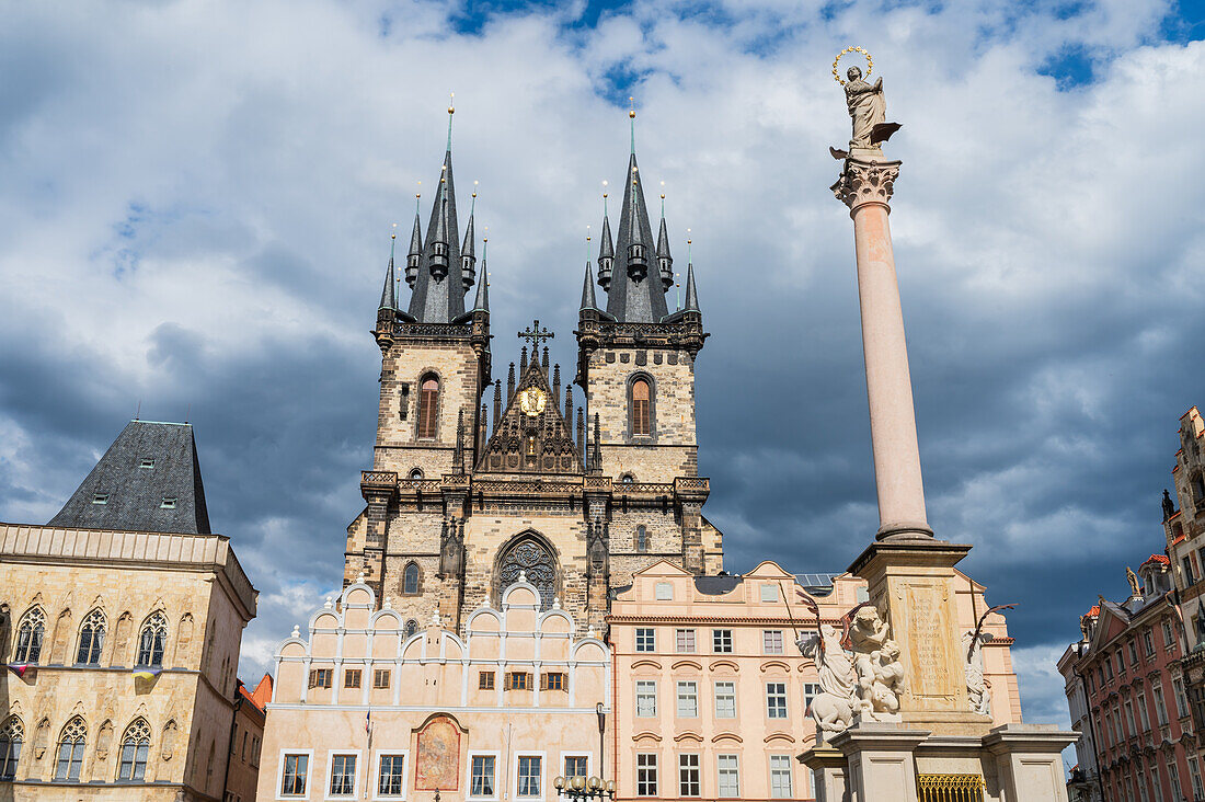 Marian Column (Mariánský sloup) in front on the Tyn Church (Týnský chrám) in Old Town Square (Staromestské námestí) in Prague