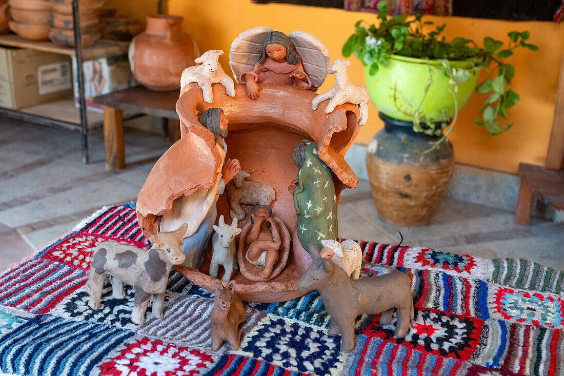 Ceramic nativity in a broken pot by indigenous Aymara ceramic artist Santina Alabar in Purmamarca, Argentina.