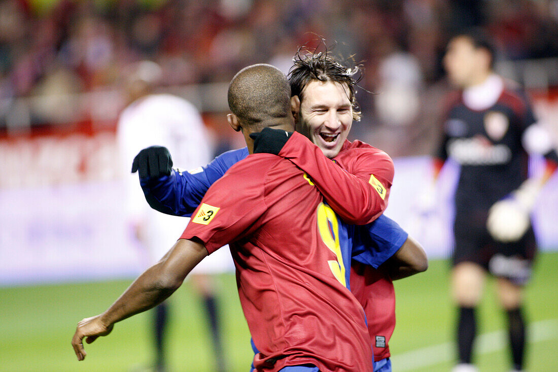 Seville, Spain, Nov 30 2008, Messi and Etoo joyfully embrace after the Cameroonian scores the first goal for Barcelona during the match in Seville.