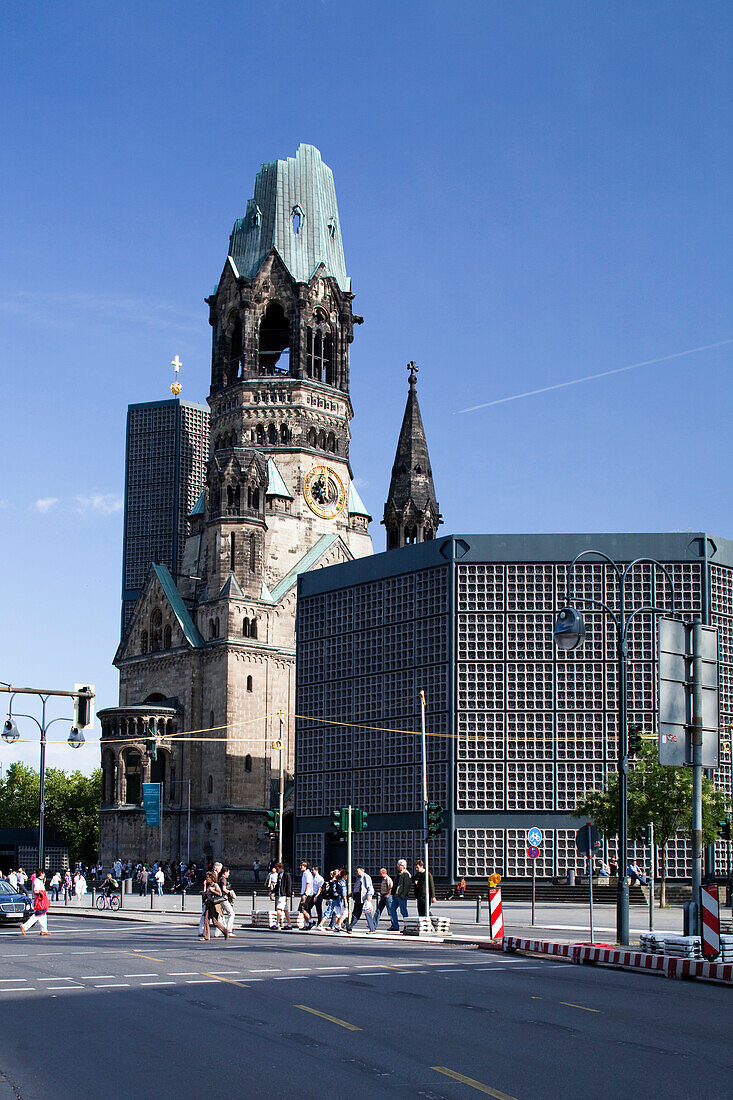 Berlin, Germany, July 24 2009, Visitors admire the historic and modern architecture of the Kaiser Wilhelm Memorial Church in Berlin, a prominent city landmark.