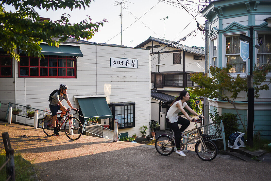 Bike riders in Philosopher's Walk in Kyoto, Japan